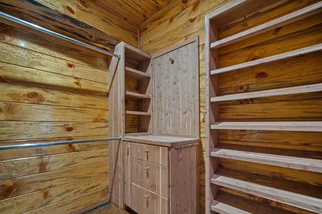 a bedroom with double bed and a window