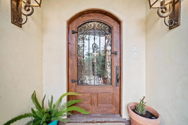 a front view of a house with garden