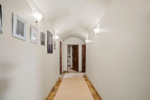 a bathroom with a granite countertop sink a toilet and a mirror