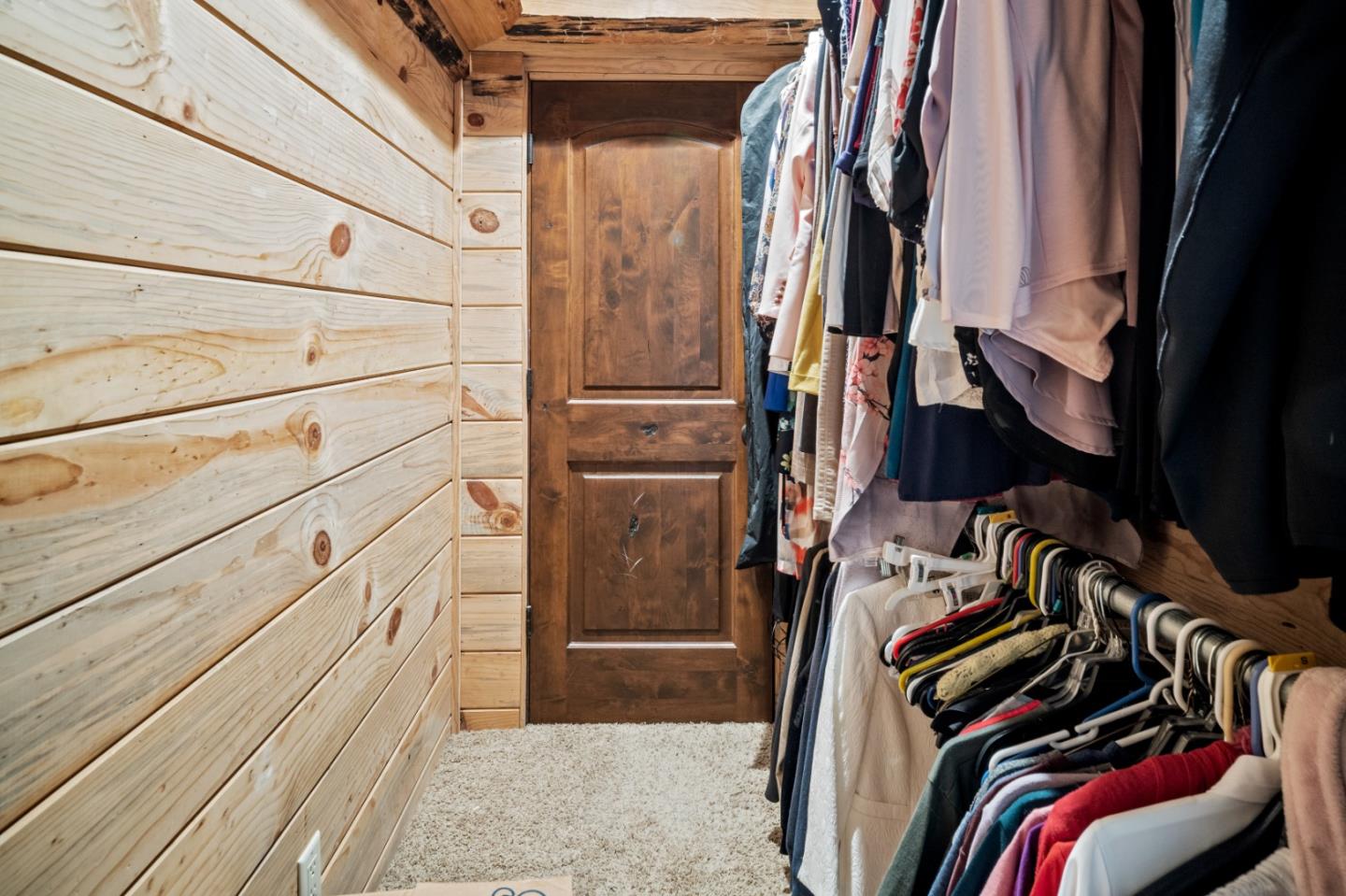 17551 Pond Derosa Lane Prunedale, CA 93907 - Photo 34 of 63 a view of walk in closet with clothes and shoes