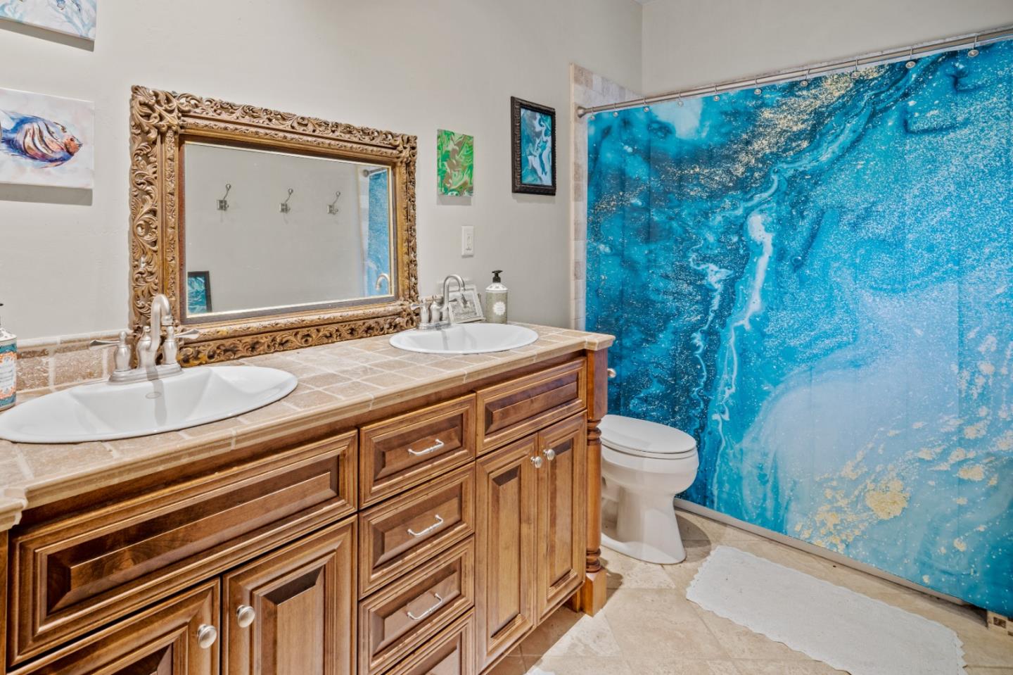 17551 Pond Derosa Lane Prunedale, CA 93907 - Photo 35 of 63 a bathroom with a granite countertop sink a toilet and a mirror