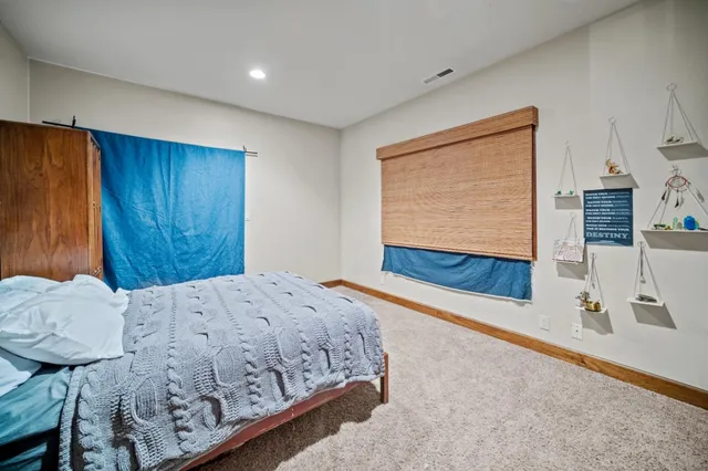 a room that has a bed and a table in it