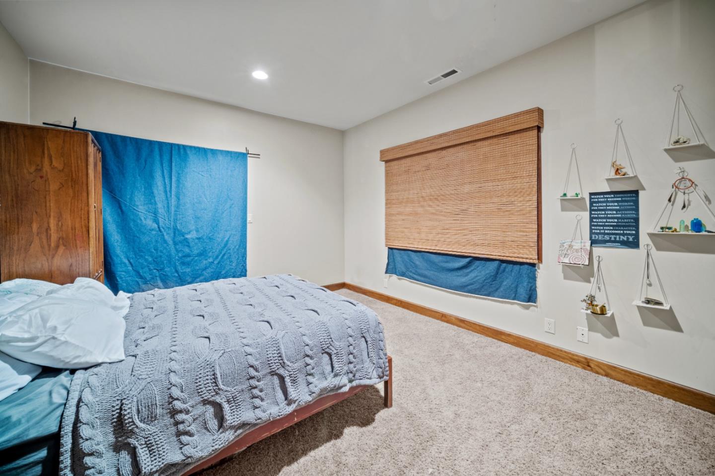 17551 Pond Derosa Lane Prunedale, CA 93907 - Photo 37 of 63 a bedroom with a bed and a dresser with wooden floor