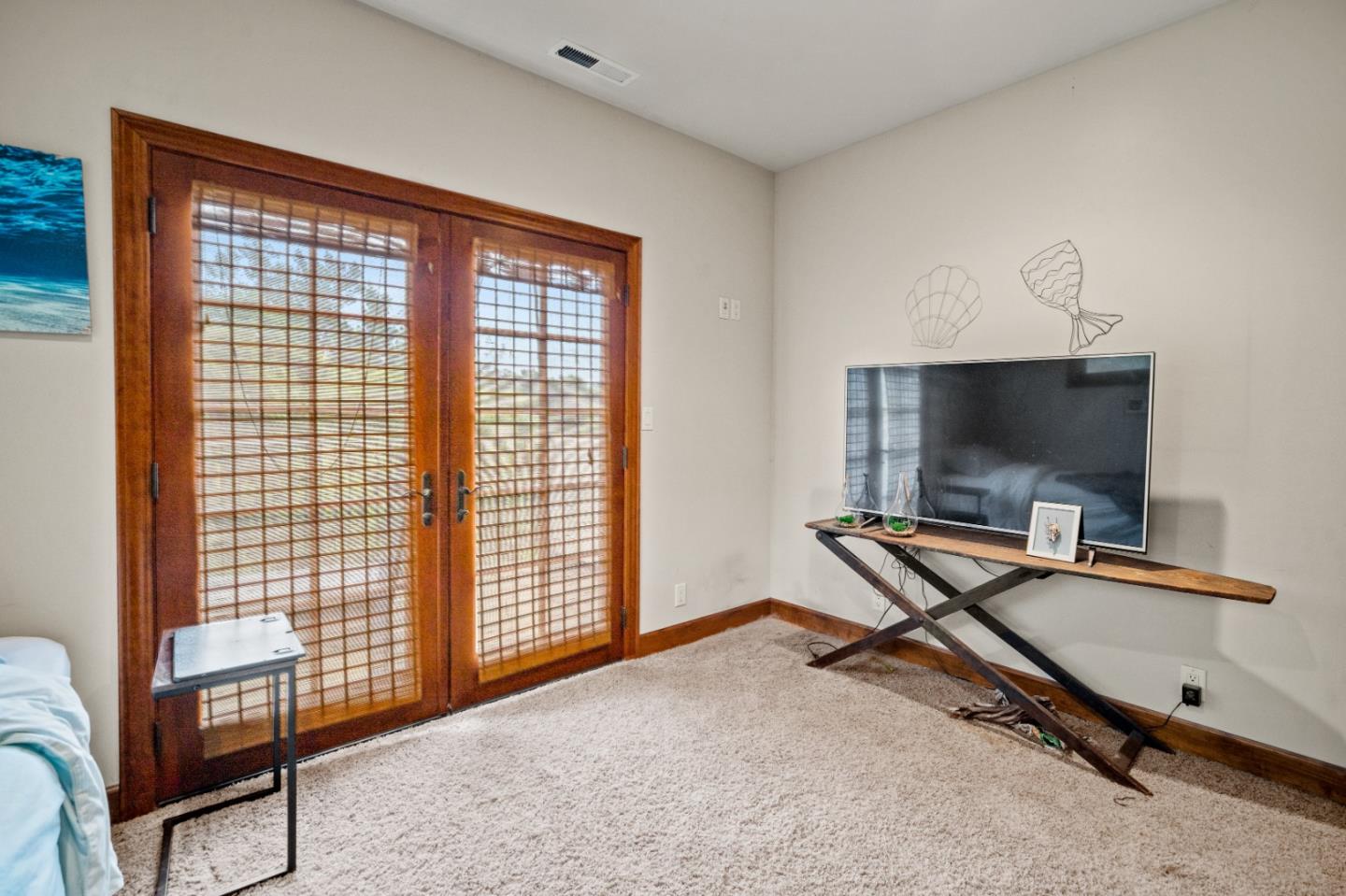 17551 Pond Derosa Lane Prunedale, CA 93907 - Photo 40 of 63 a living room with furniture a flat screen tv and a window
