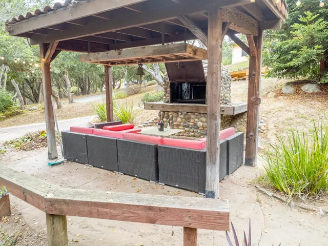 a view of a backyard with sitting area