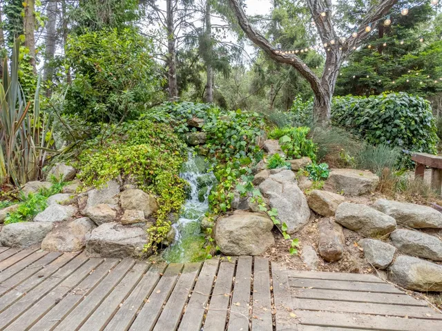 a view of backyard with seating space