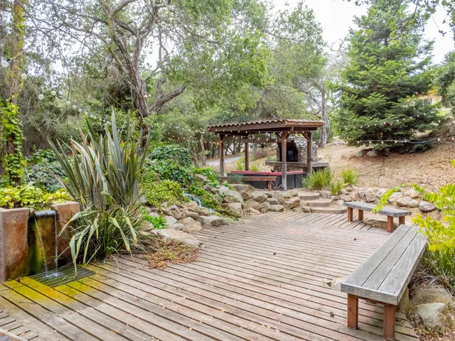 a view of a chairs and table in the patio