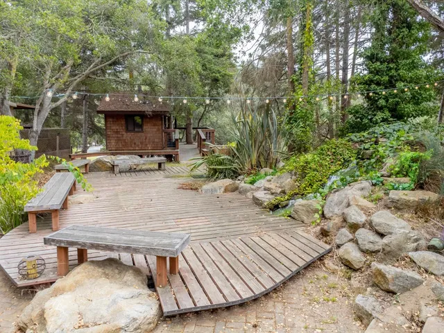 a view of a house with a table and chairs