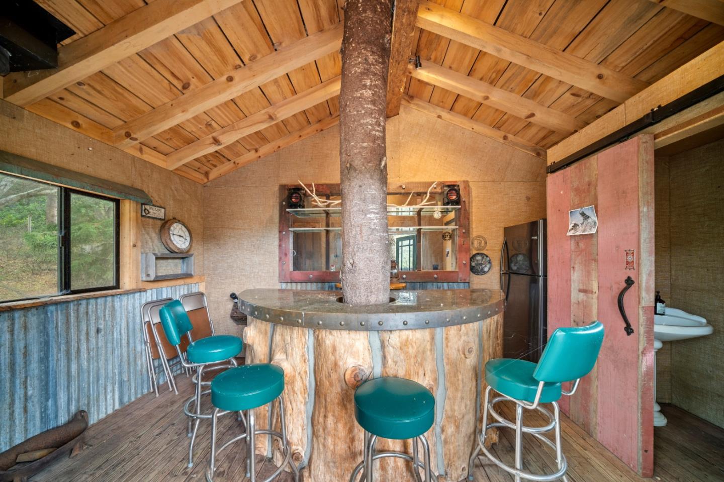 17551 Pond Derosa Lane Prunedale, CA 93907 - Photo 49 of 63 a view of a dining room with furniture a chandelier and wooden floor