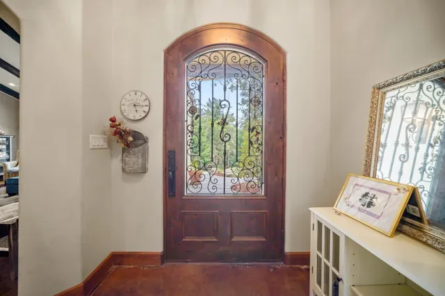 a view of entryway with furniture and a window