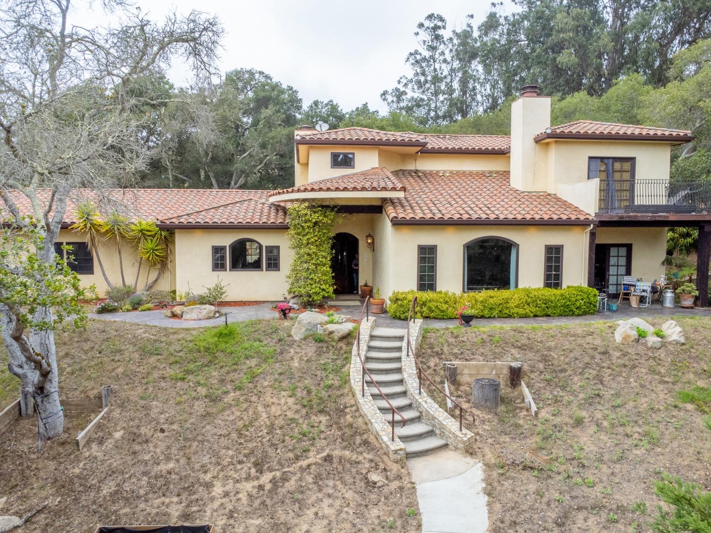 17551 Pond Derosa Lane Prunedale, CA 93907 - Photo 60 of 63 a front view of a house with garden