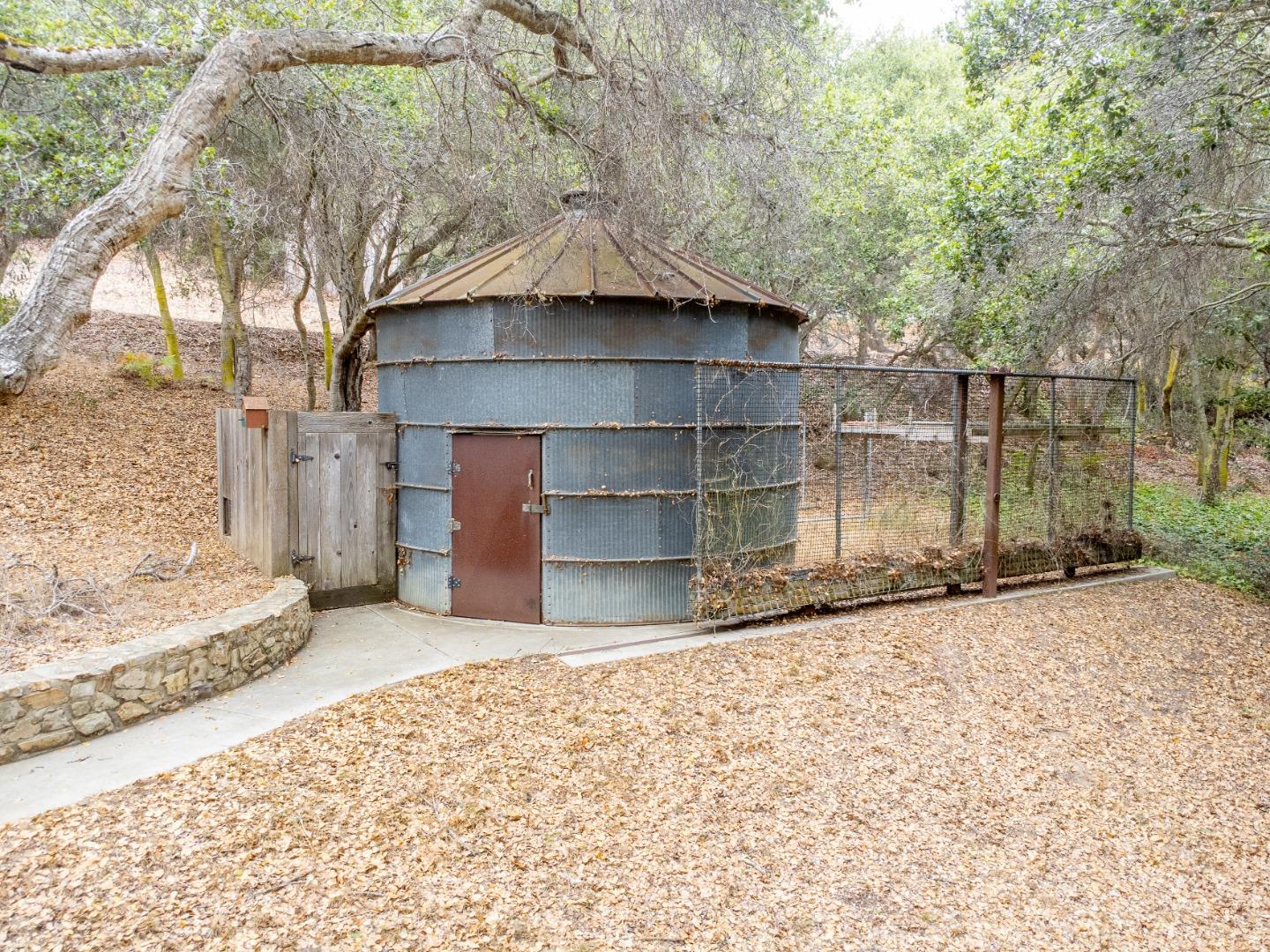 17551 Pond Derosa Lane Prunedale, CA 93907 - Photo 61 of 63 a wooden house with a large tree in front of it