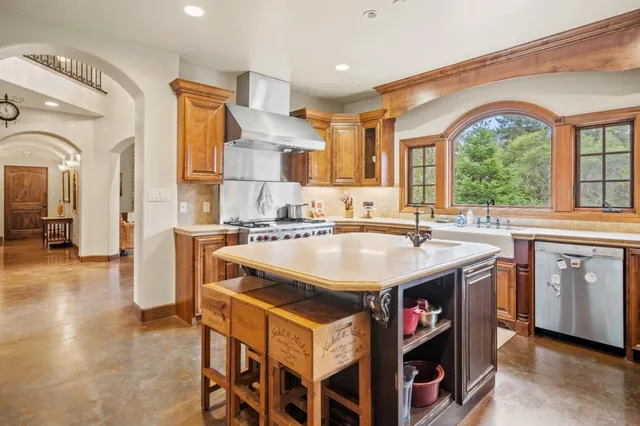 a kitchen with a stove and a sink