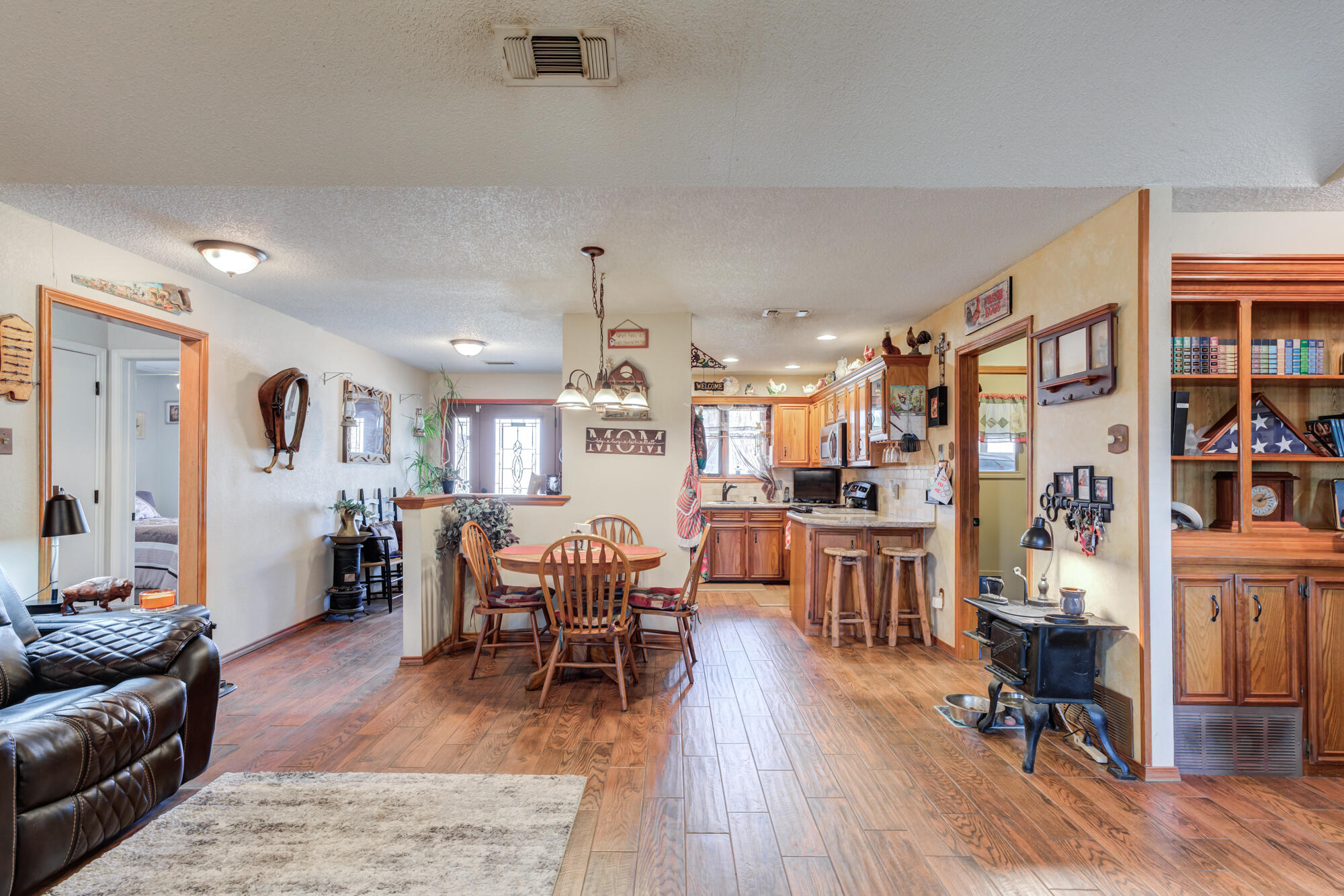 2213 86th Street Lubbock, TX 79423 - Photo 11 of 42 a living room with furniture and a wooden floor