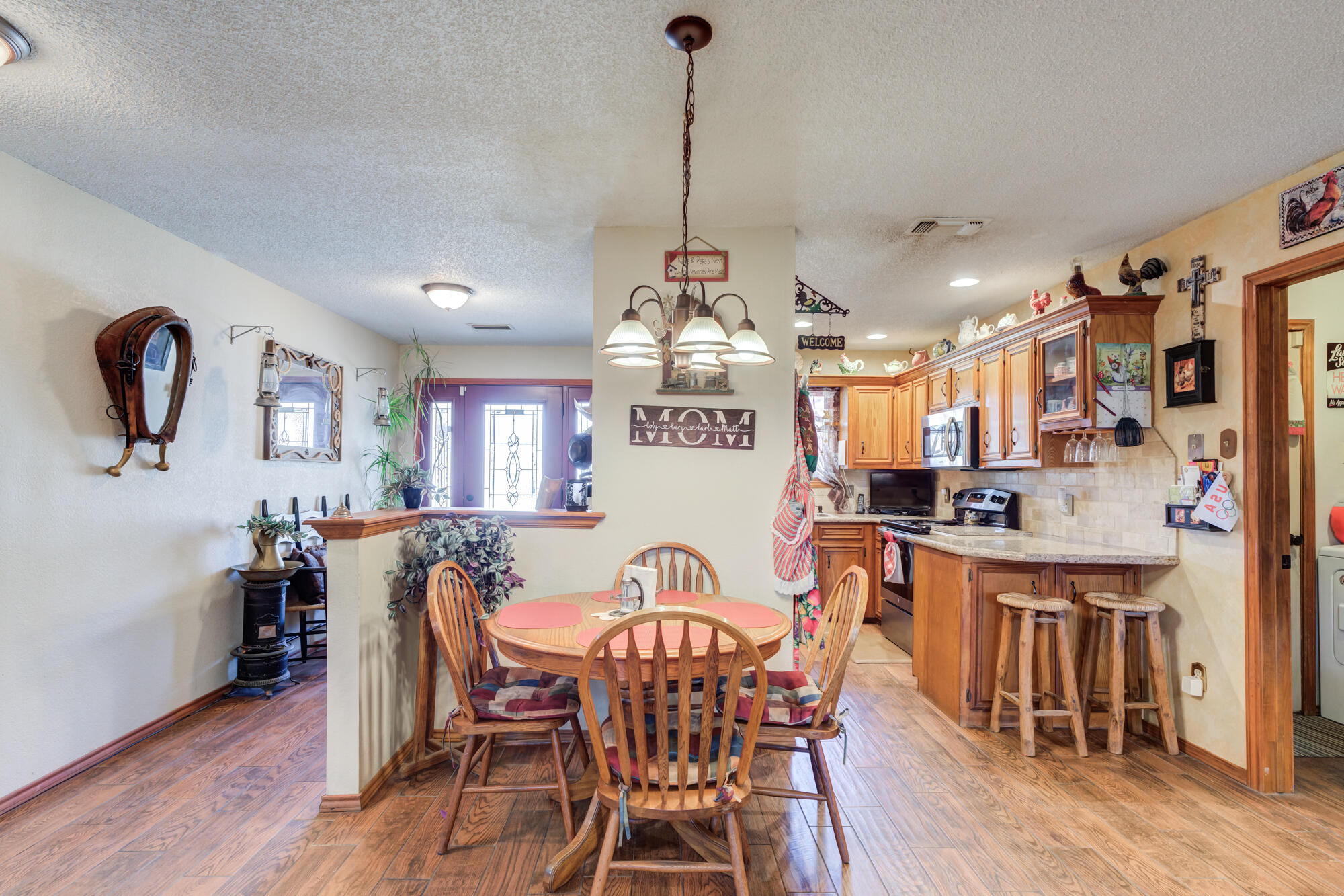 2213 86th Street Lubbock, TX 79423 - Photo 12 of 42 a view of a dining room with furniture window and wooden floor