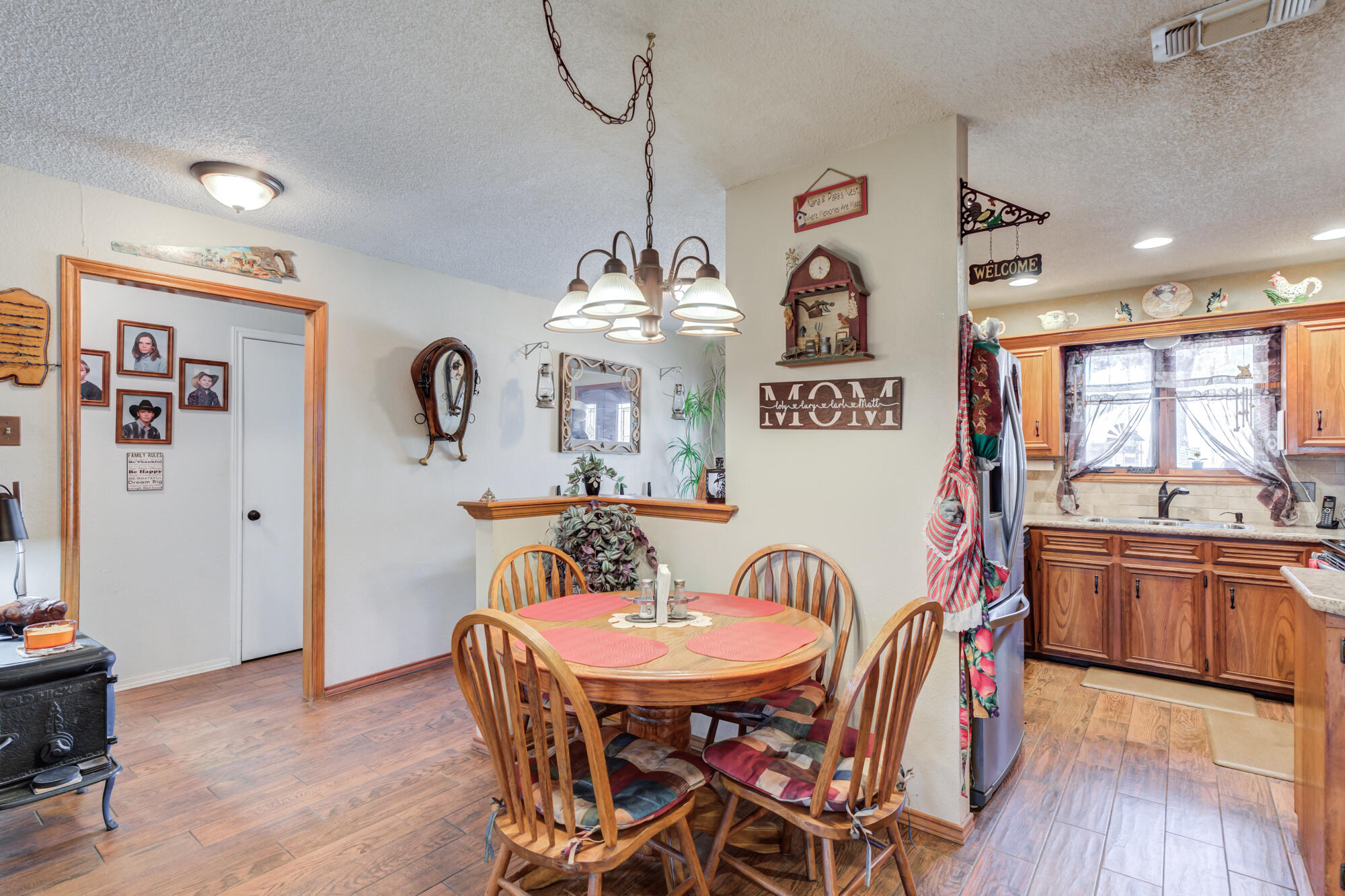2213 86th Street Lubbock, TX 79423 - Photo 13 of 42 a view of a dining room with furniture window and wooden floor