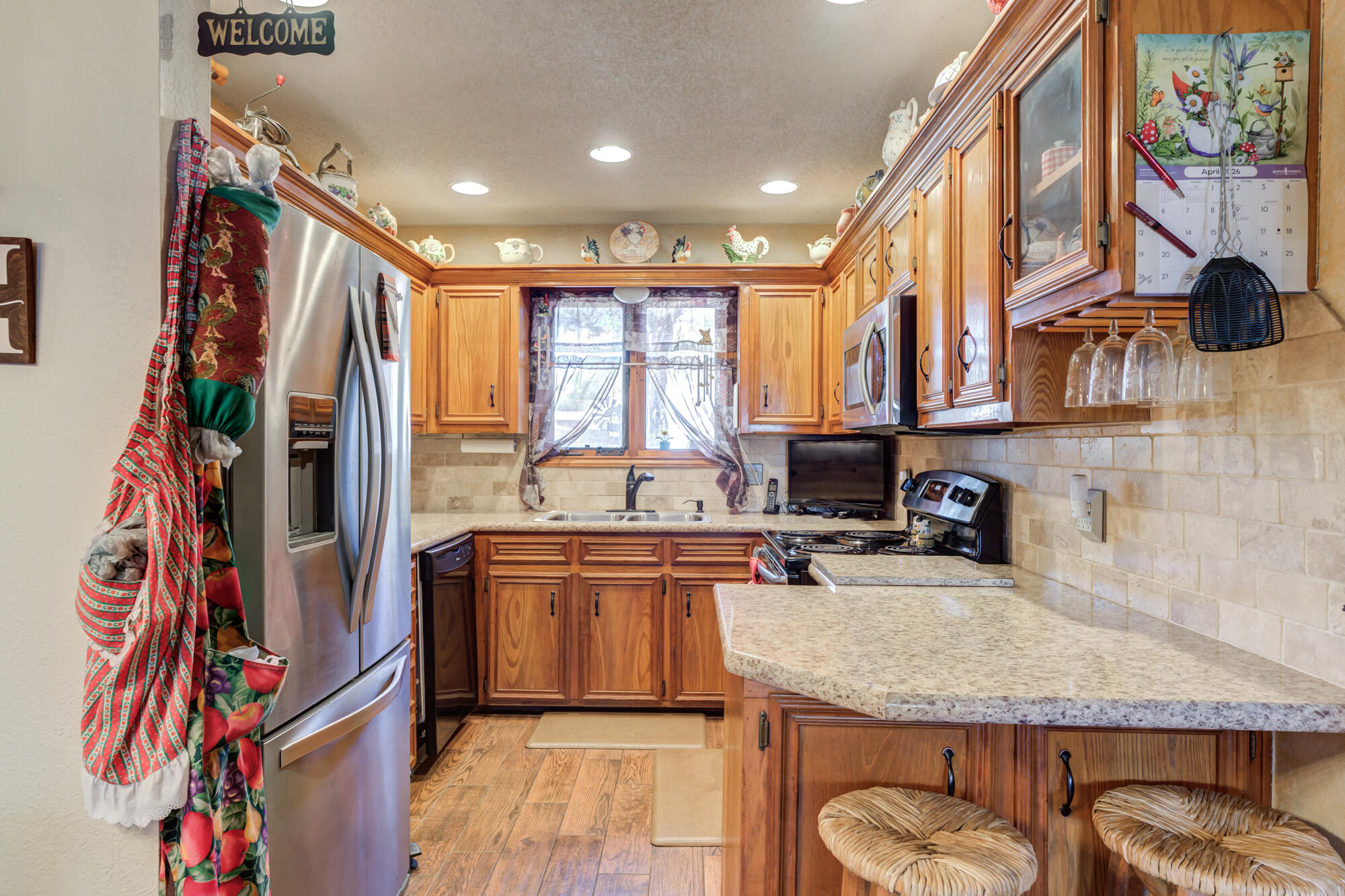 2213 86th Street Lubbock, TX 79423 - Photo 17 of 42 a kitchen with stainless steel appliances granite countertop a refrigerator and a sink
