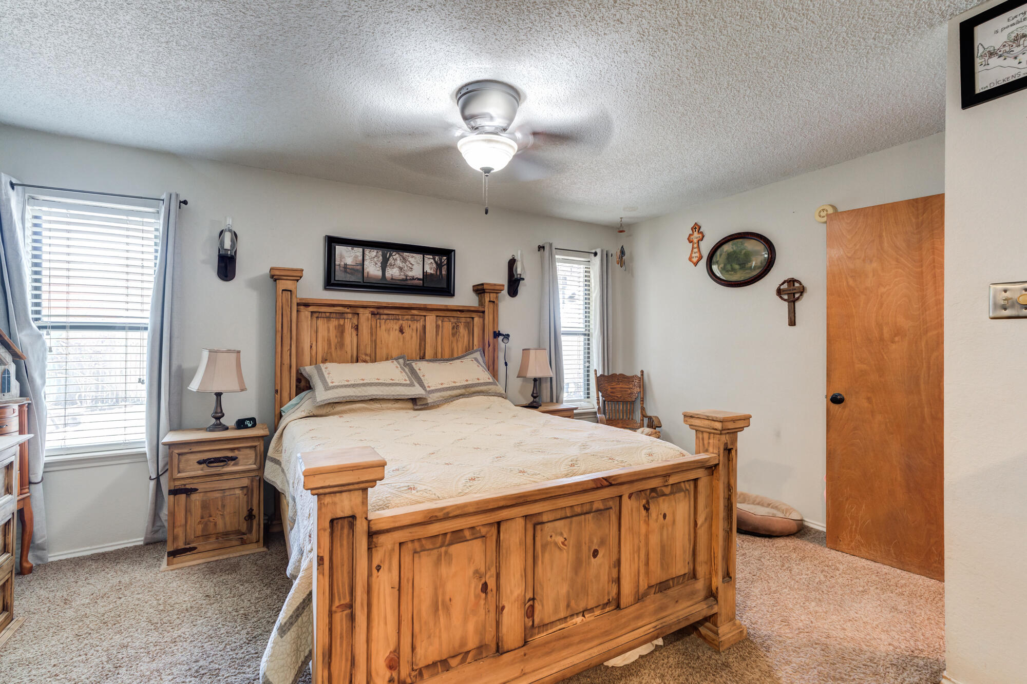 2213 86th Street Lubbock, TX 79423 - Photo 20 of 42 a bedroom with a bed and a table