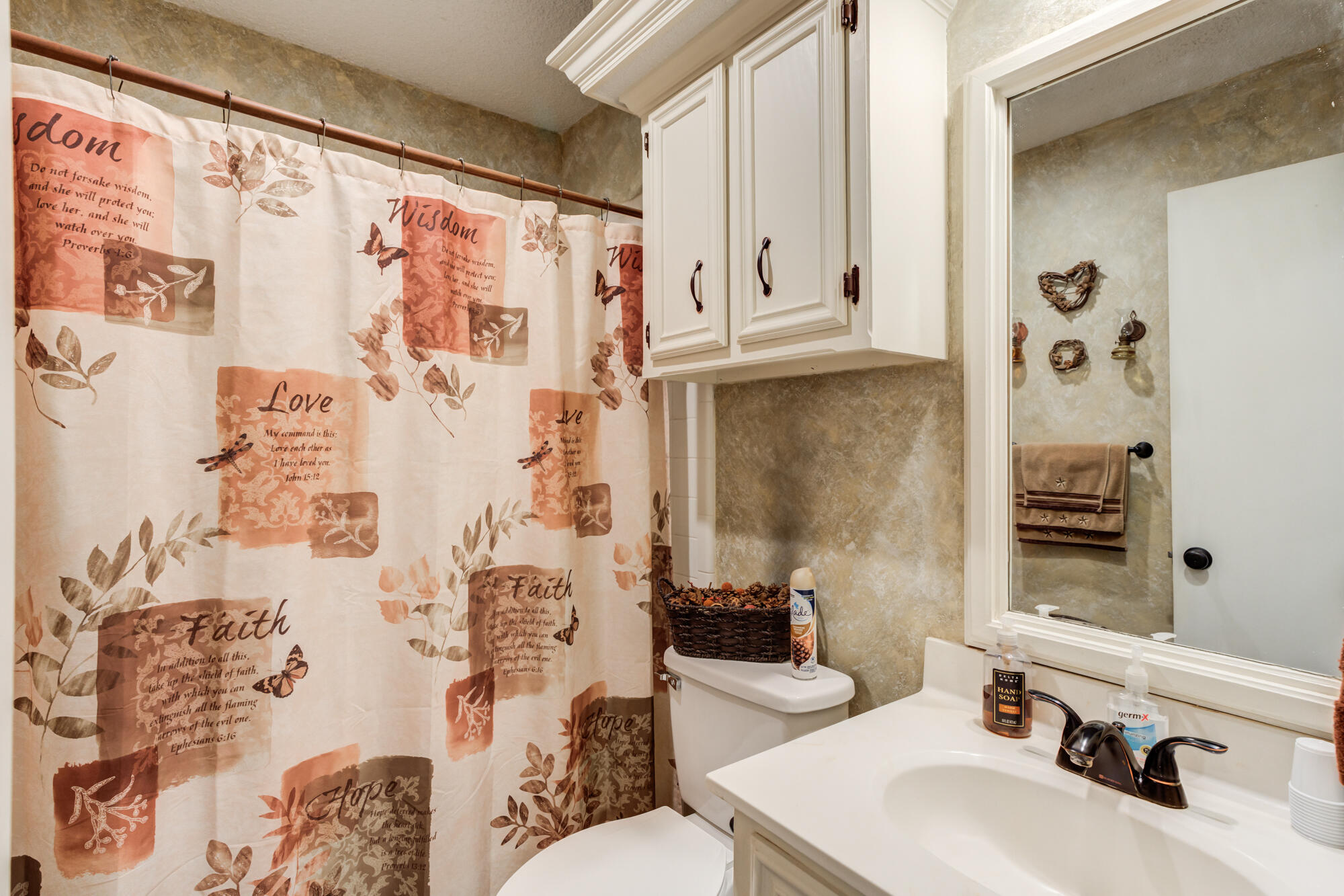 2213 86th Street Lubbock, TX 79423 - Photo 21 of 42 a bathroom with a sink toilet and shower