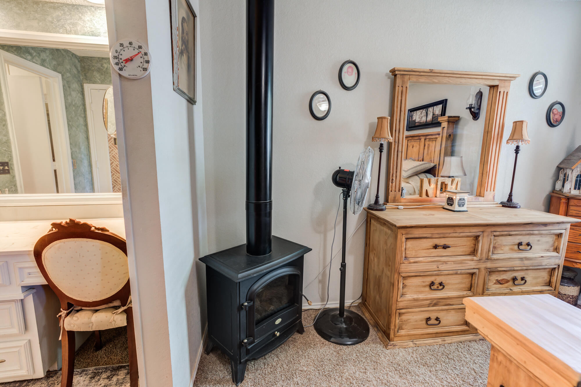 2213 86th Street Lubbock, TX 79423 - Photo 22 of 42 a bathroom with a sink a mirror and a mirror