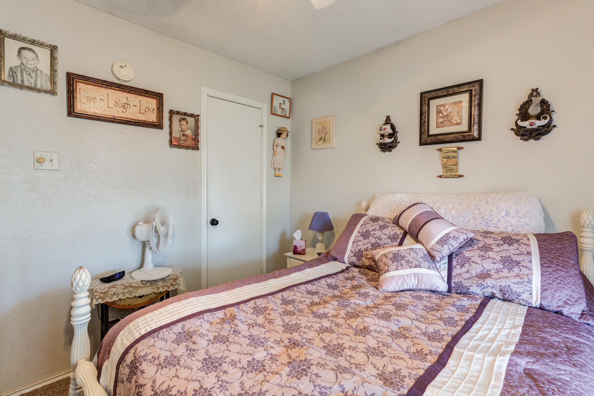 2213 86th Street Lubbock, TX 79423 - Photo 25 of 42 a bedroom with a bed and the dresser