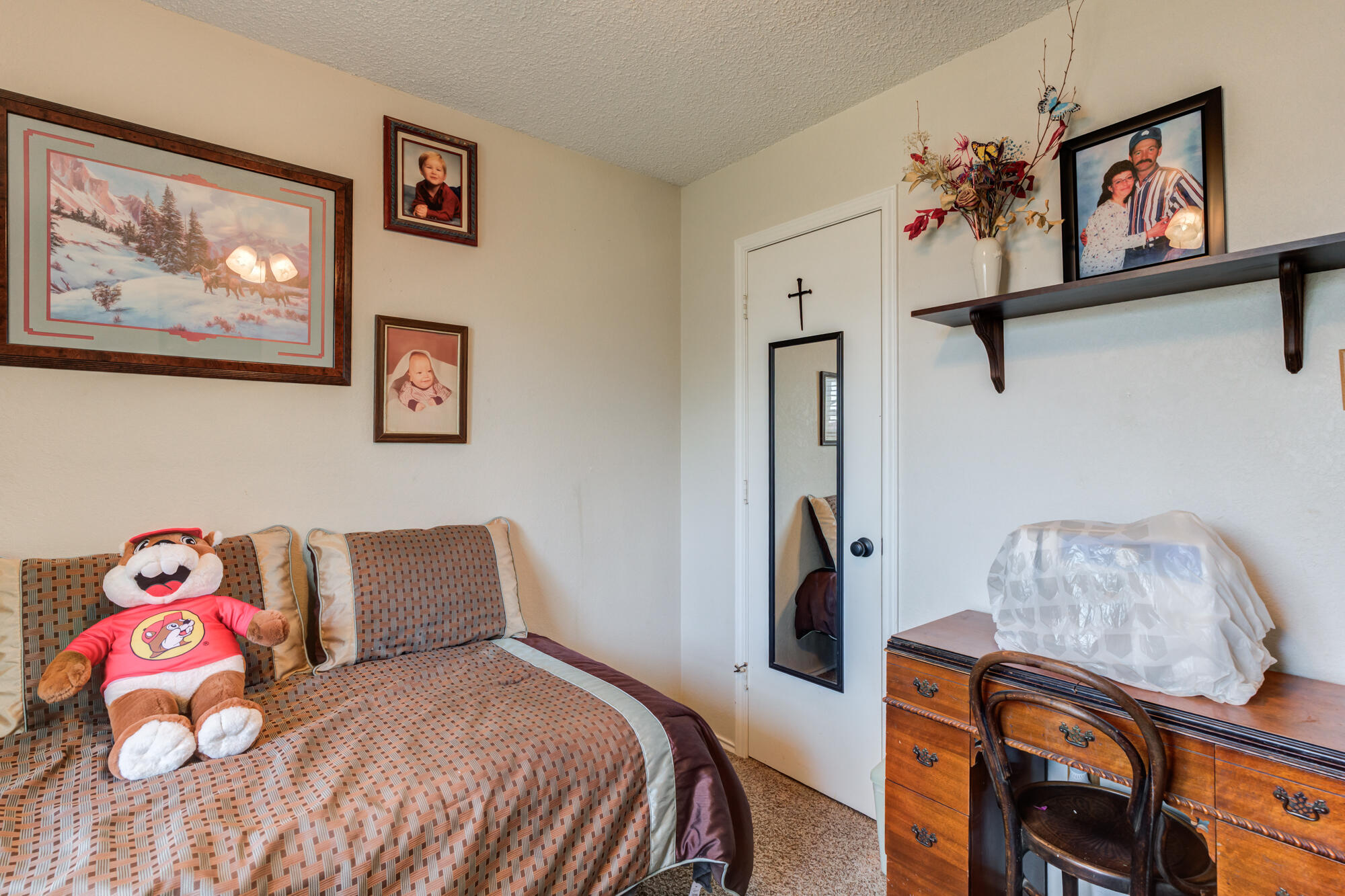 2213 86th Street Lubbock, TX 79423 - Photo 30 of 42 a bedroom with a bed and wooden floor
