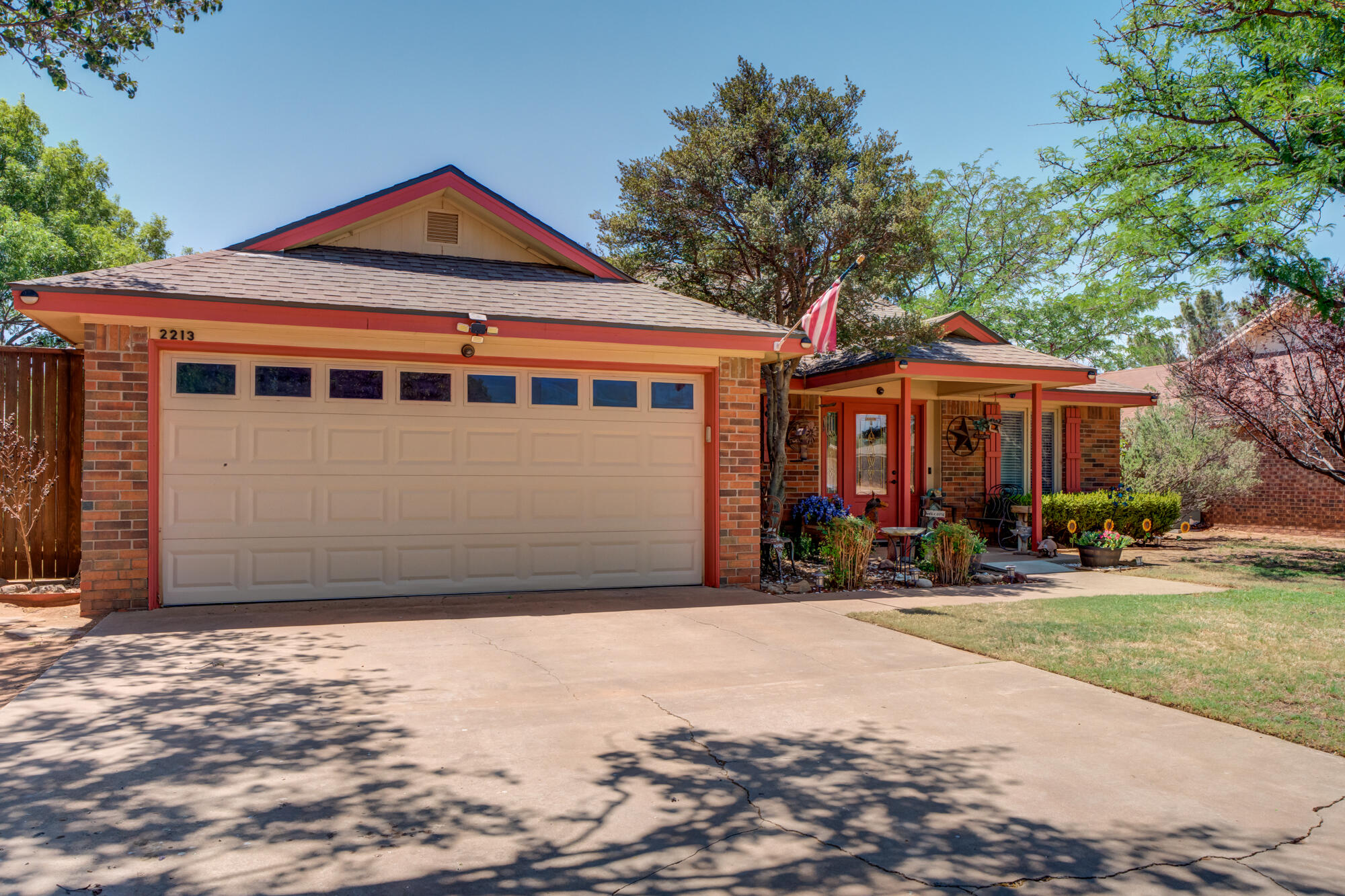 2213 86th Street Lubbock, TX 79423 - Photo 3 of 42 a front view of a house with a yard