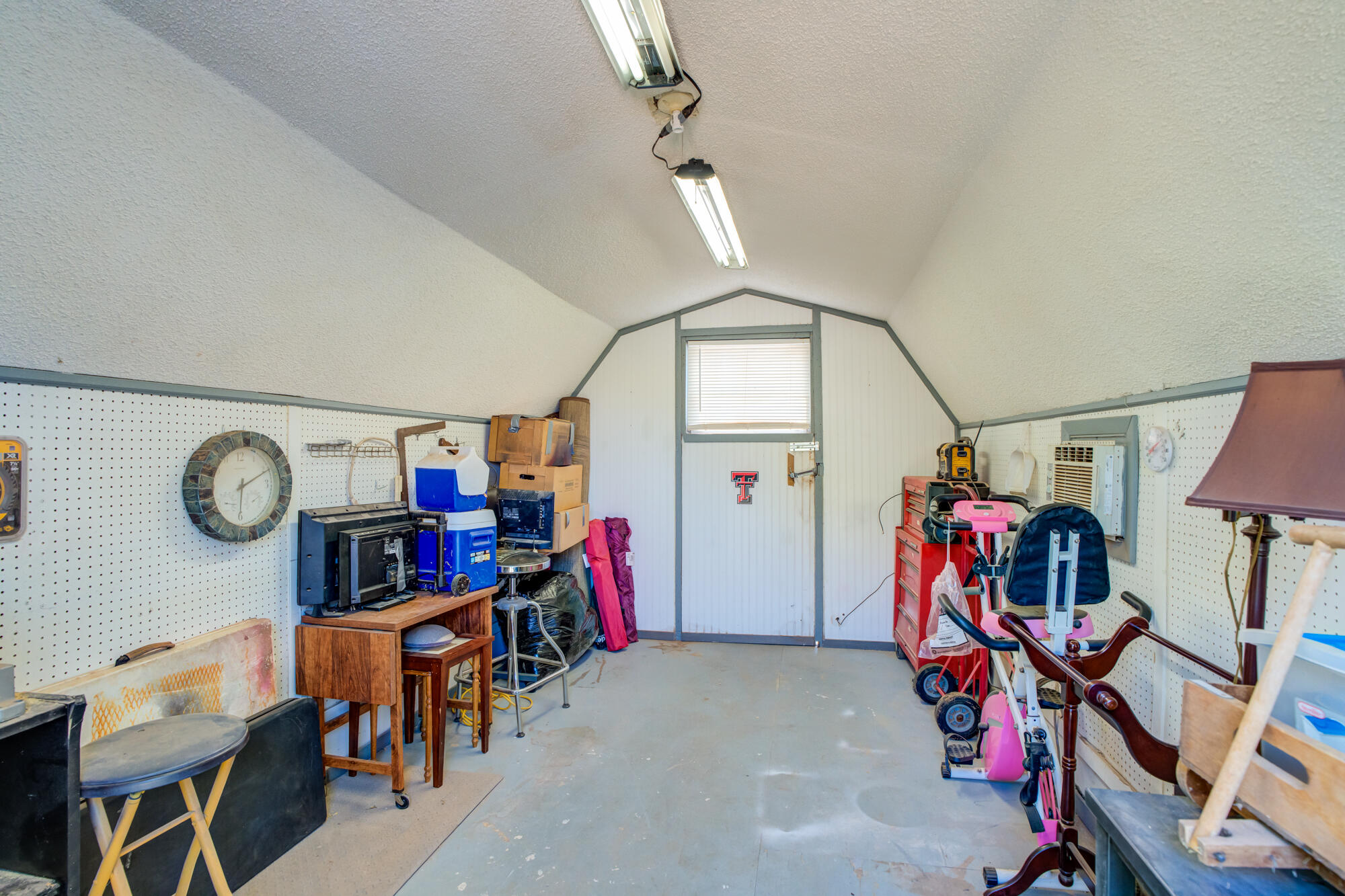 2213 86th Street Lubbock, TX 79423 - Photo 32 of 42 a view of a room with gym equipment