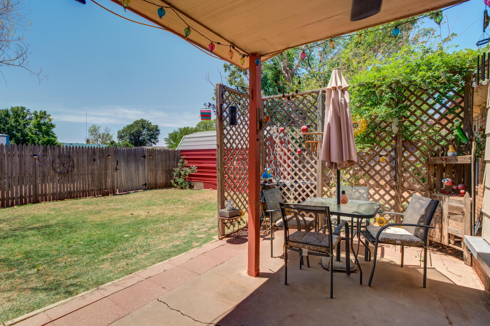 2213 86th Street Lubbock, TX 79423 - Photo 34 of 42 a view of a backyard with a sitting area