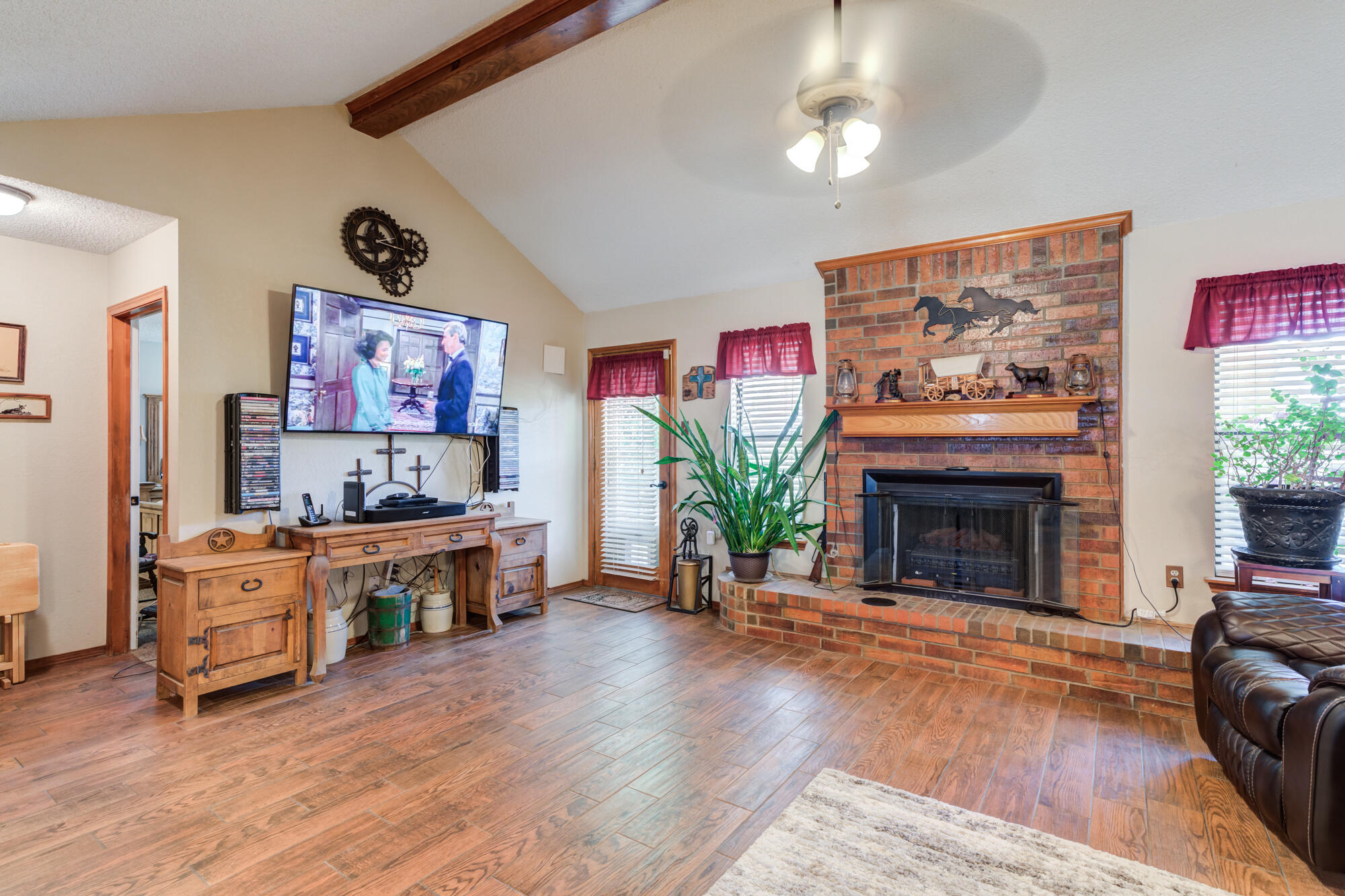 2213 86th Street Lubbock, TX 79423 - Photo 5 of 42 a living room with furniture and a fireplace