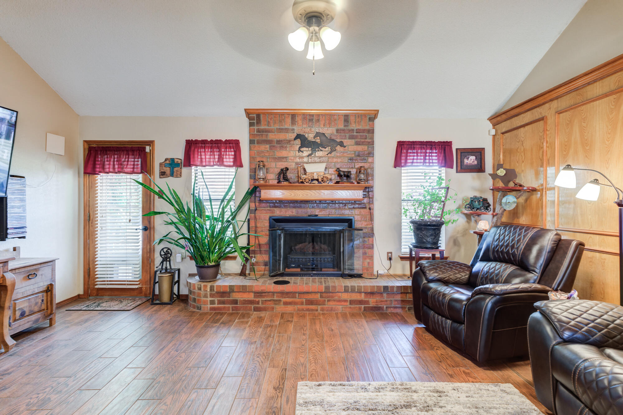 2213 86th Street Lubbock, TX 79423 - Photo 6 of 42 a living room with furniture and a fireplace