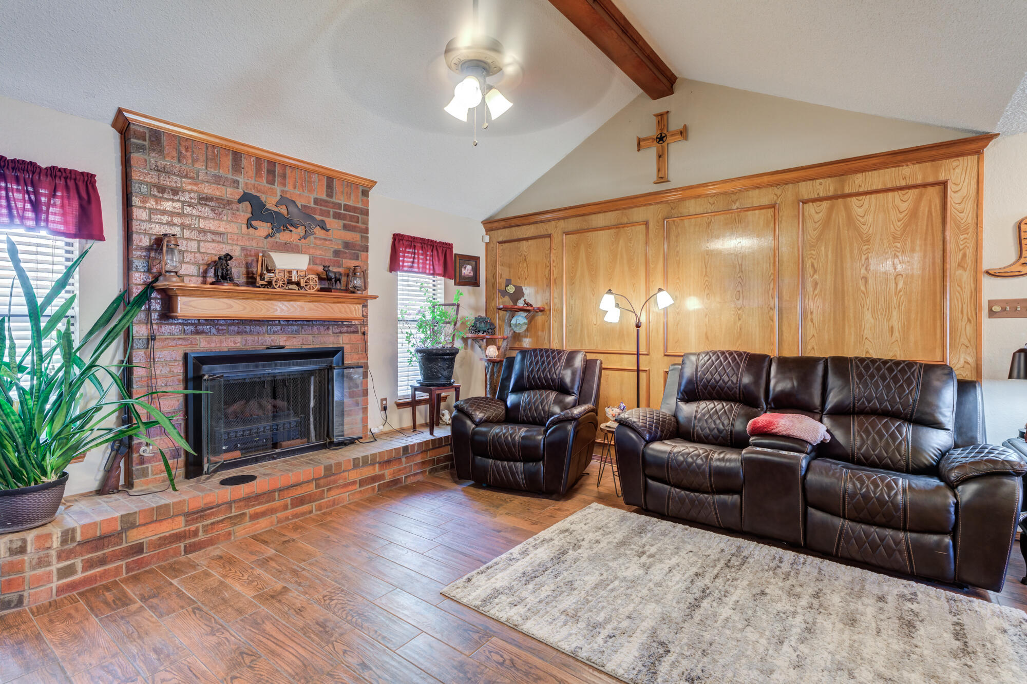 2213 86th Street Lubbock, TX 79423 - Photo 7 of 42 a living room with furniture a fireplace and a large window