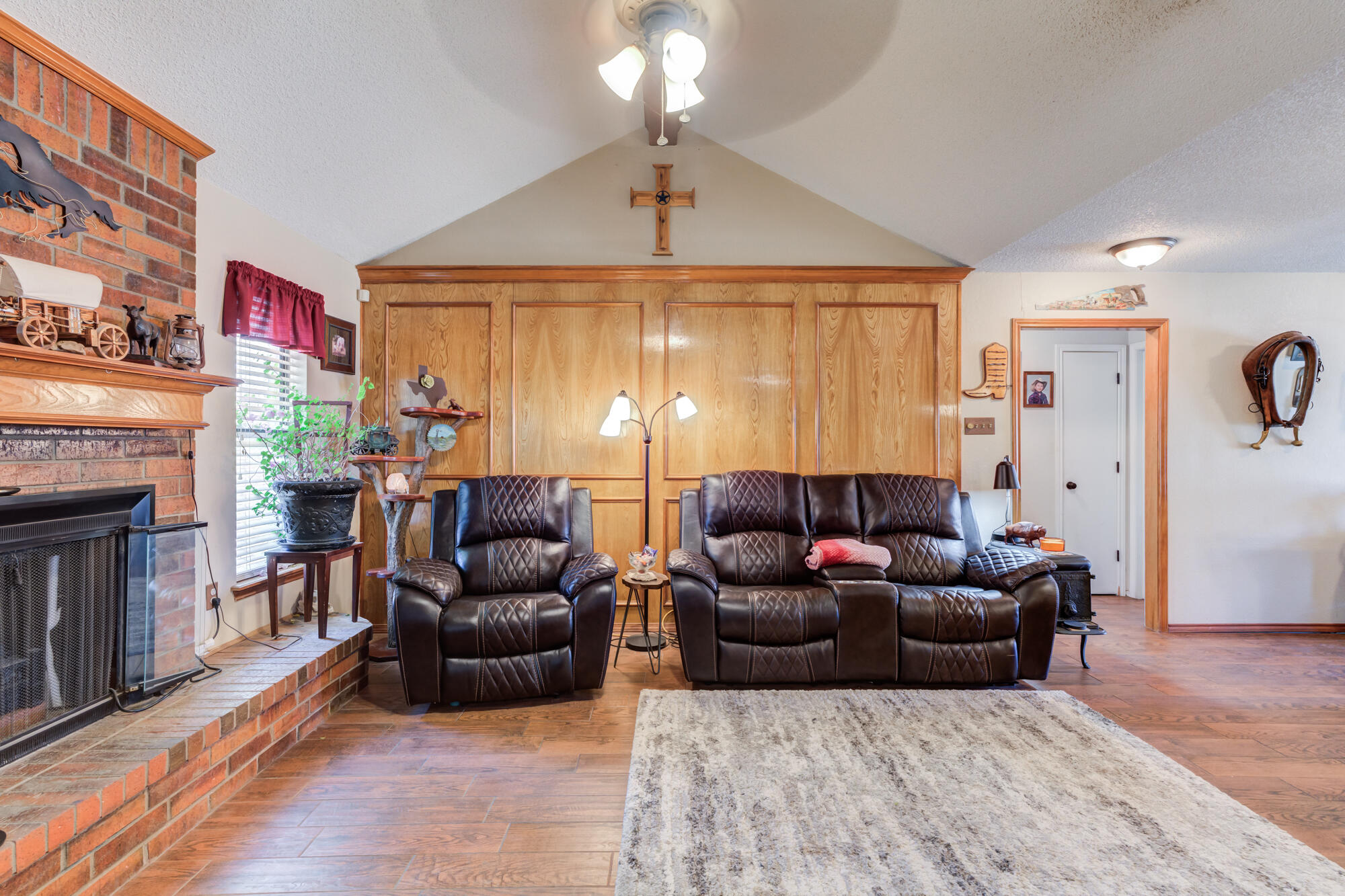 2213 86th Street Lubbock, TX 79423 - Photo 9 of 42 a living room with furniture and a fireplace