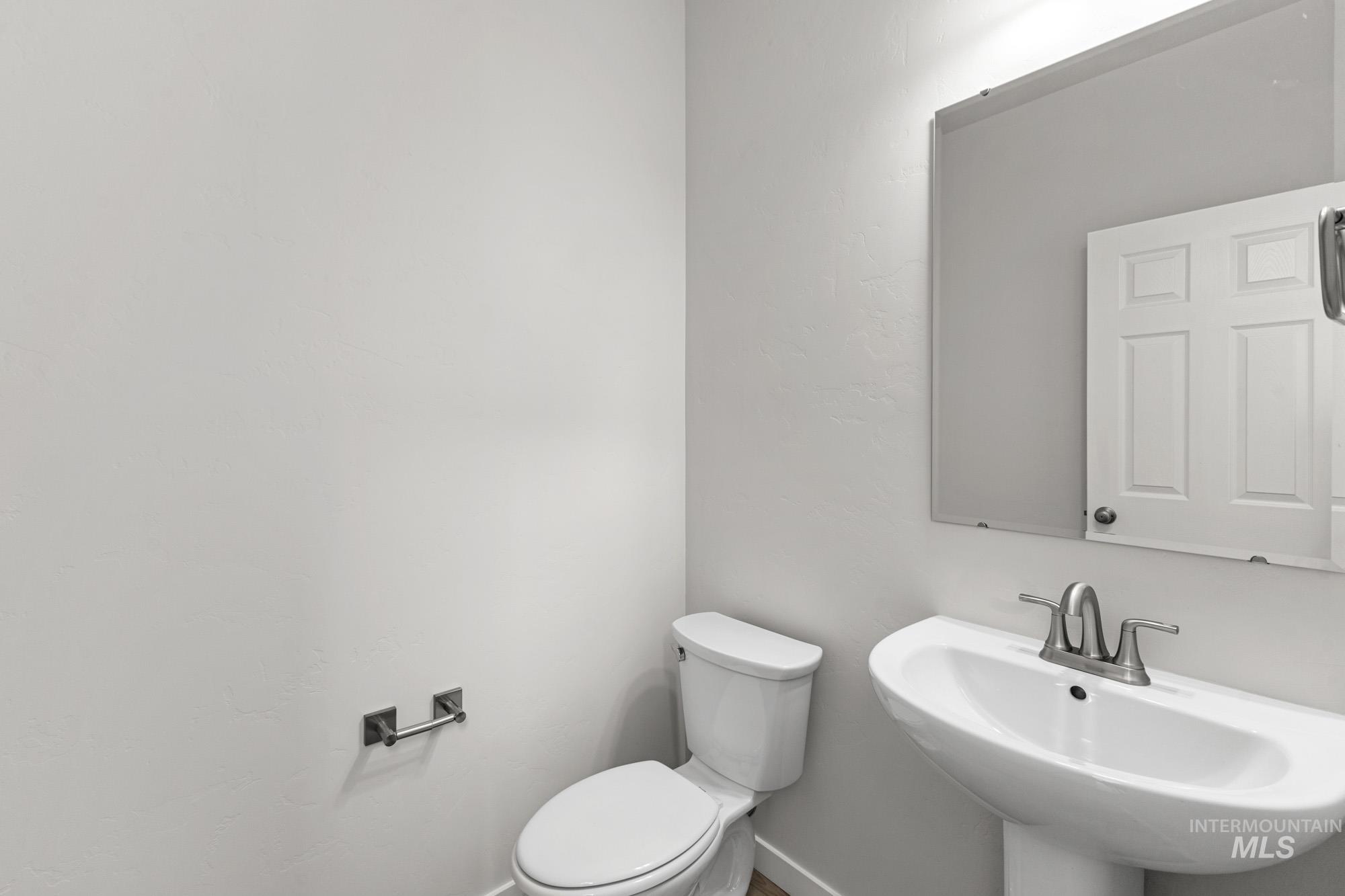 13708 Judson Street Caldwell, ID 83607 - Photo 14 of 29 Half bathroom featuring toilet and a sink