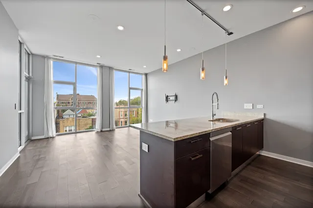 a kitchen with a sink and large window