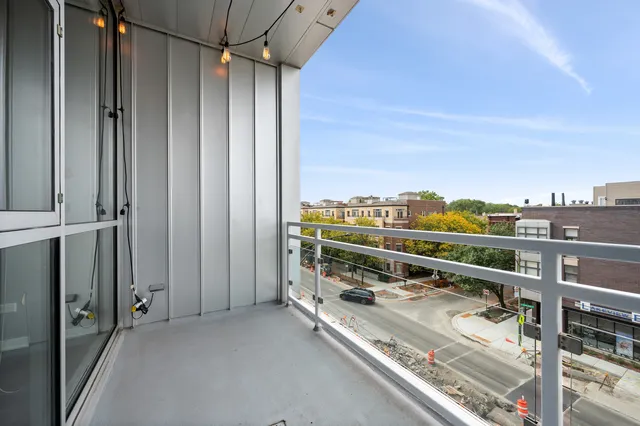 a view of balcony with furniture