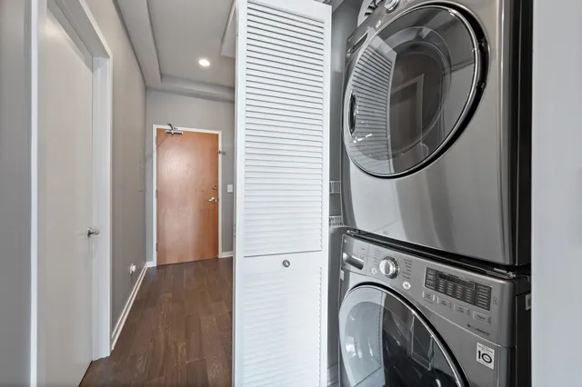 a view of a hallway with washer and dryer