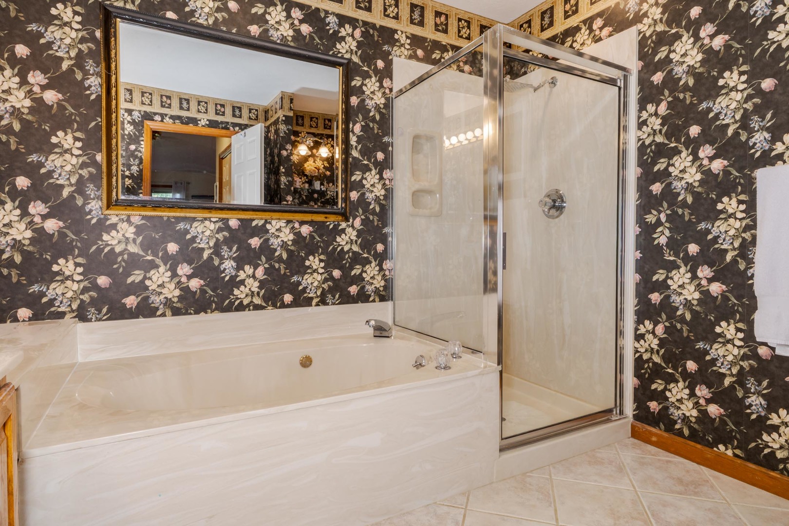 1412 B Tamarack Country Club Trail Normal, IL 61761 - Photo 19 of 35 a bathroom with a bathtub and a shower