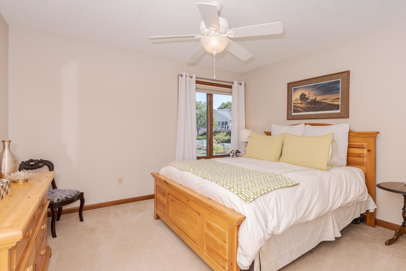 1412 B Tamarack Country Club Trail Normal, IL 61761 - Photo 20 of 35 a bedroom with a bed and a chandelier