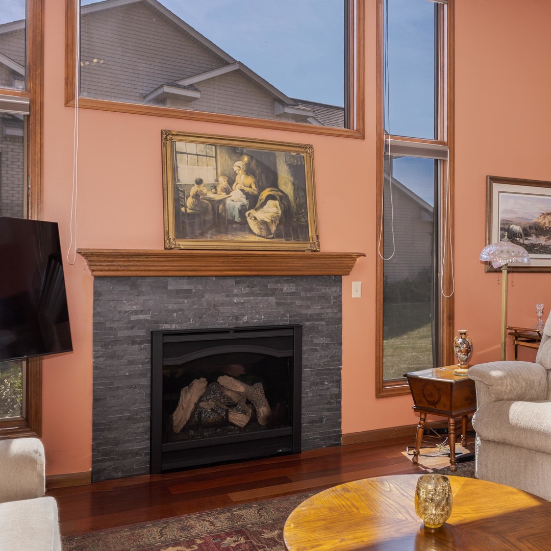 1412 B Tamarack Country Club Trail Normal, IL 61761 - Photo 6 of 35 a living room with furniture and a fireplace