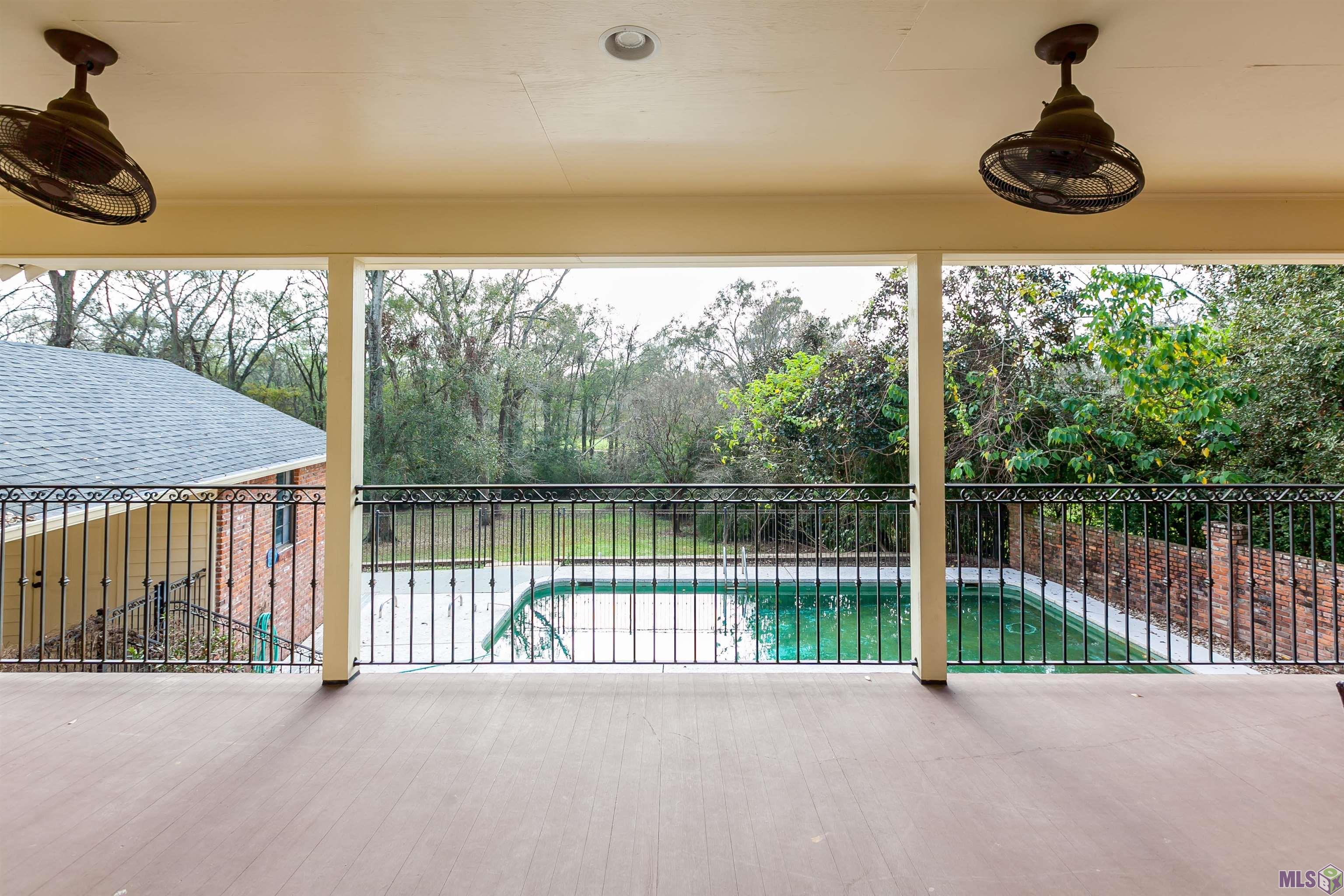 6414 Highland Road Baton Rouge, LA 70808 - Photo 2 of 25 Upstairs Balcony Overlooking Pool and Large Fenced Backyard