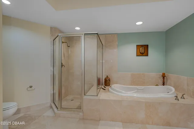 a bathroom with a tub and a shower