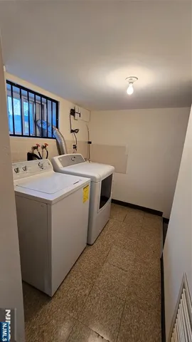 a view of a chair and table in the patio with a garden