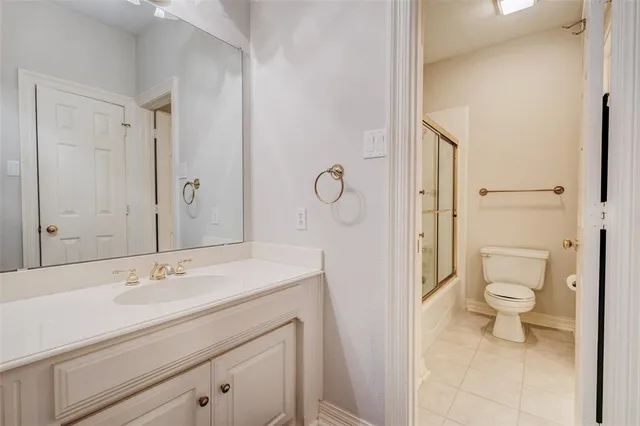 walk in closet with lots of frames on wall