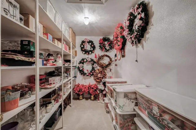 a front view of a house with a garden and yard