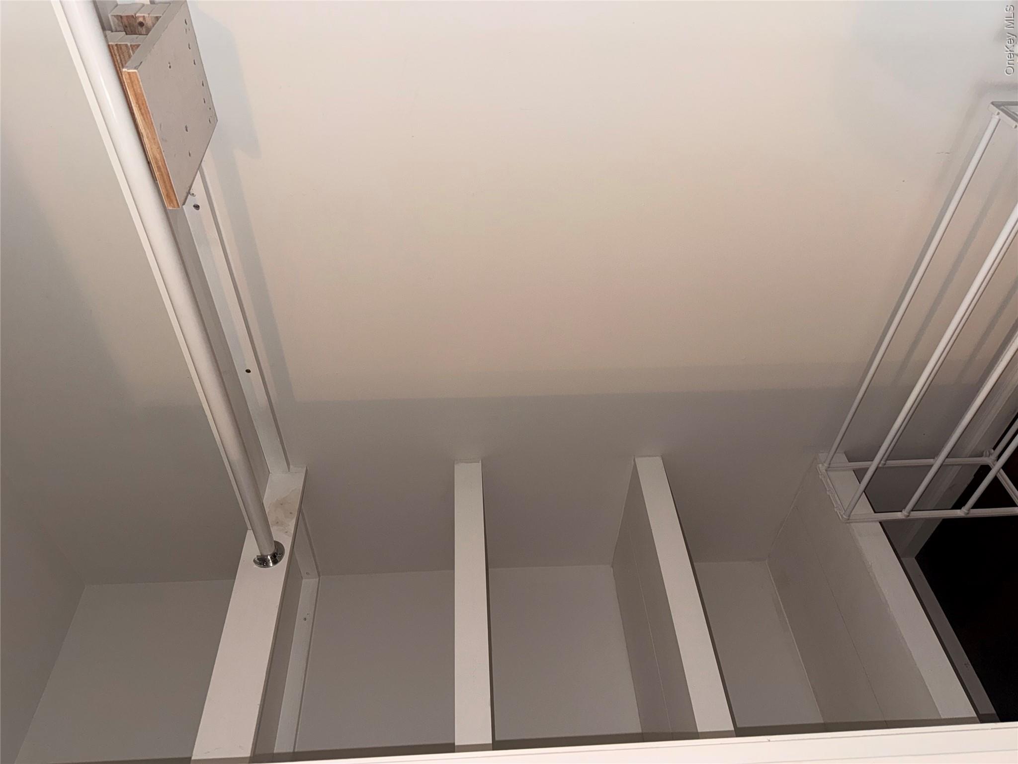 1661 Old Country Road, Unit 516 Riverhead, NY 11901 - Photo 37 of 50 a view of an empty walk in closet