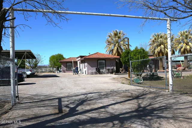 a view of a backyard with sitting area