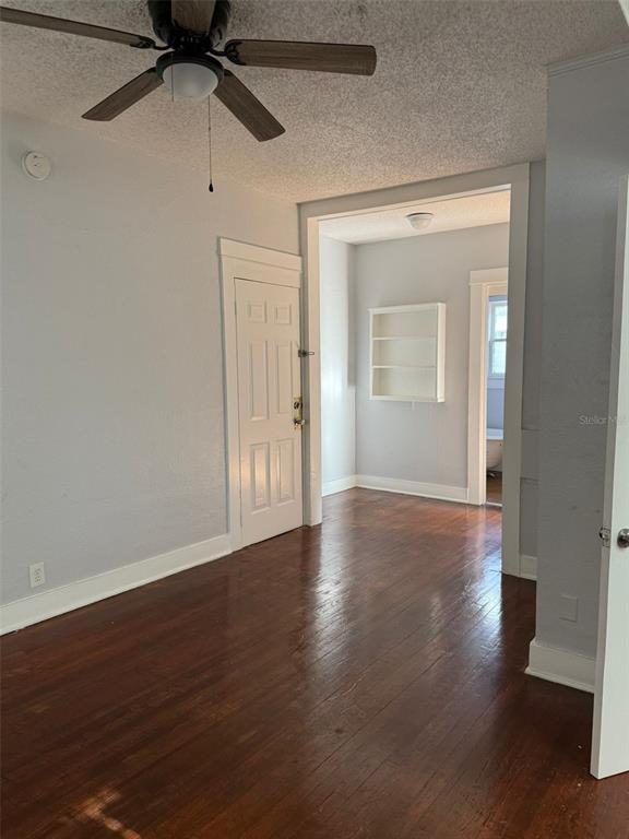 308 Grove Street North, Unit 206 St. Petersburg, FL 33701 - Photo 12 of 12 a view of a room with wooden floor fan and window