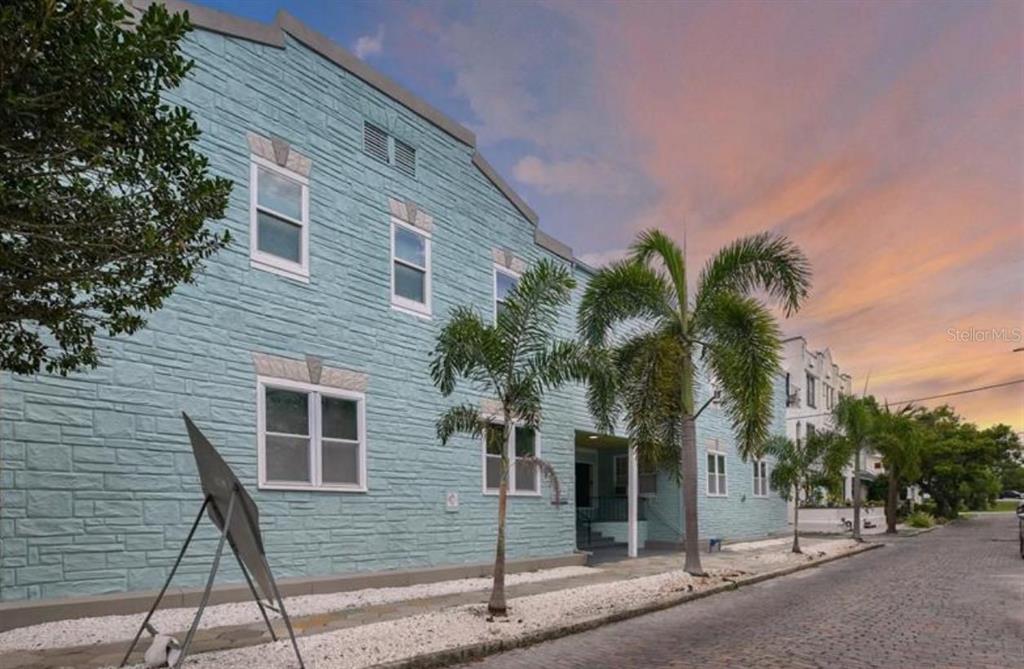 308 Grove Street North, Unit 206 St. Petersburg, FL 33701 - Photo 3 of 12 a view of a house with a tree