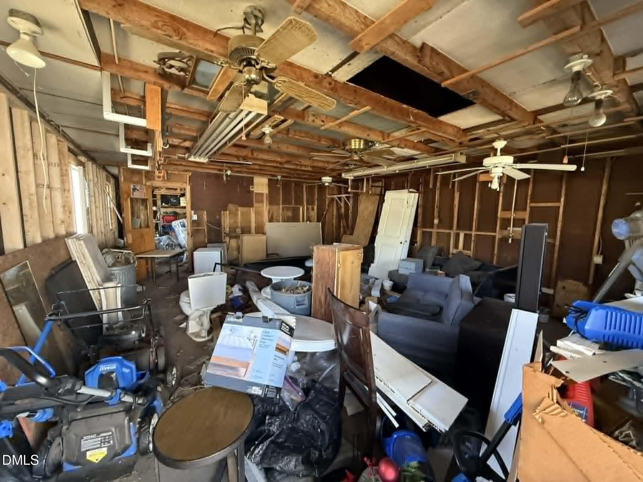 14 South Mason Street Coats, NC 27521 - Photo 4 of 4 a view of a storage room with washer and dryer